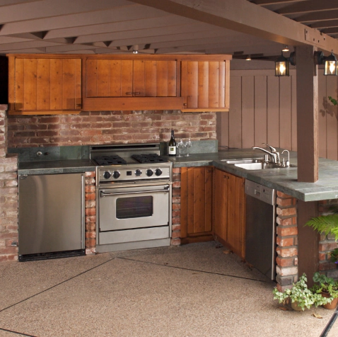 outdoor kitchen with wooden cabinets