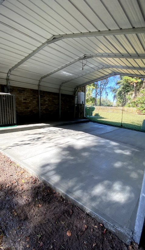 residential parking area with concrete floor
